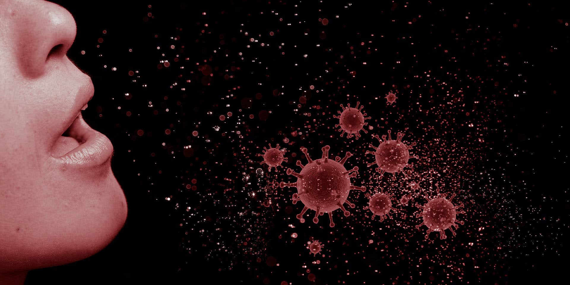 A person breathing with virus particles outside on a black background